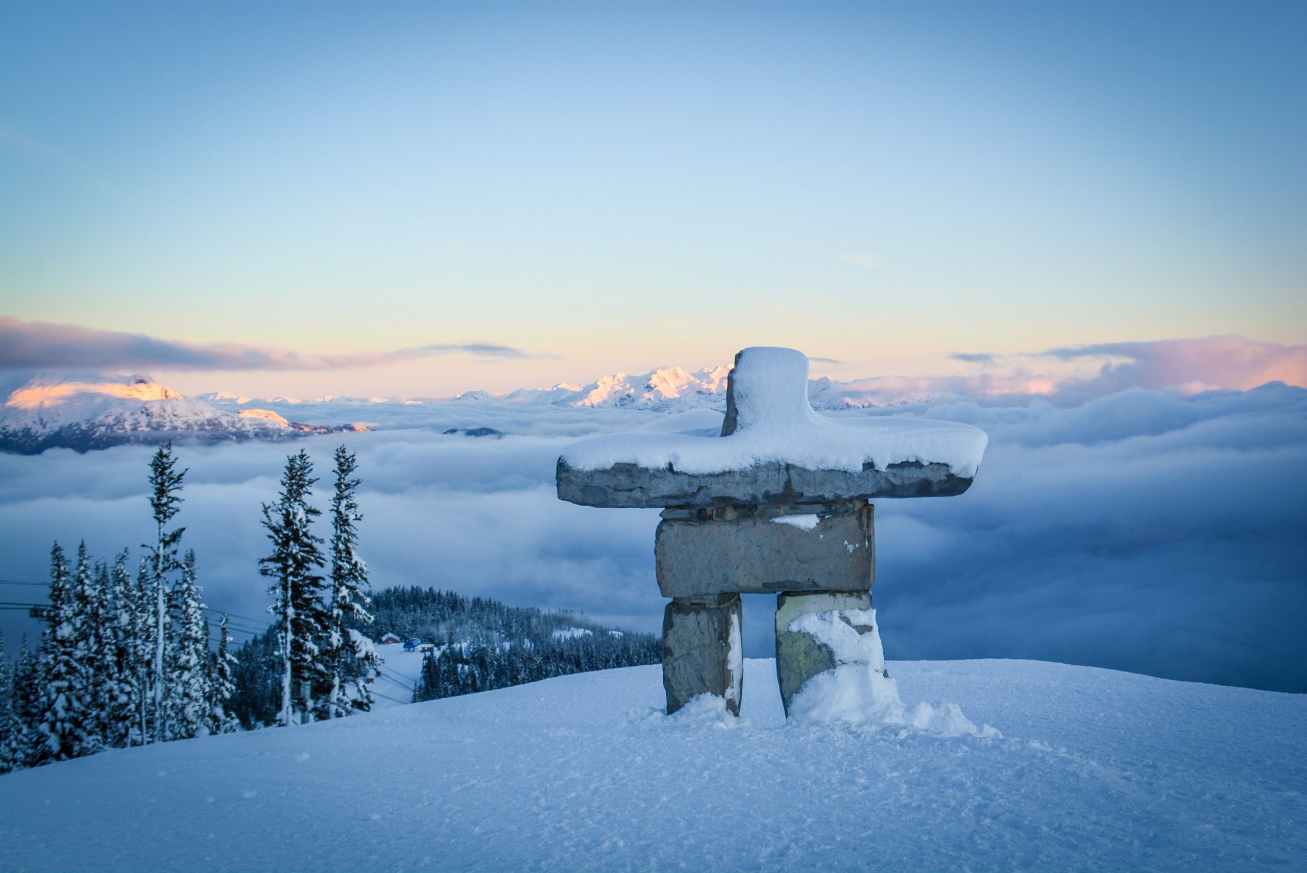 Mountain top inukshuk at sunrise