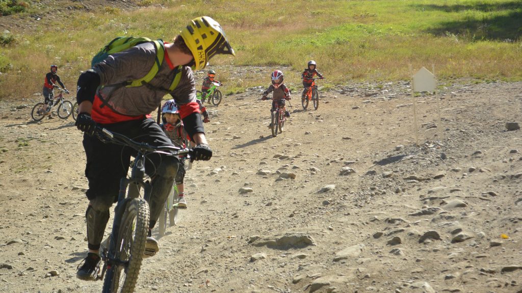 Whistler Mountain bike guide shows young kids the basics of downhill mountain biking. 