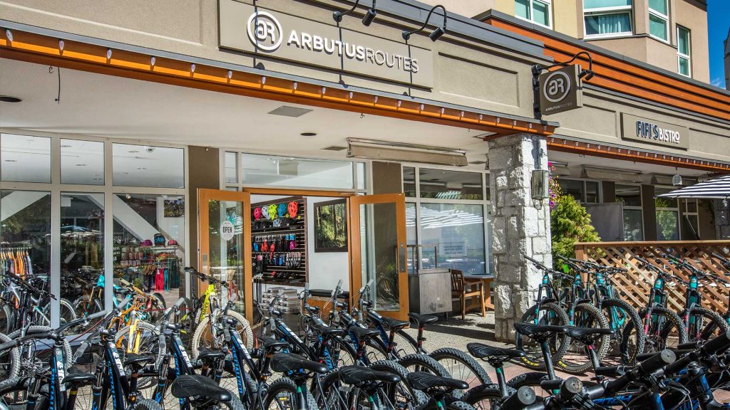 Store front of Arbutus Routes in Whistler Village for mountain bike rentals and guided tours. 