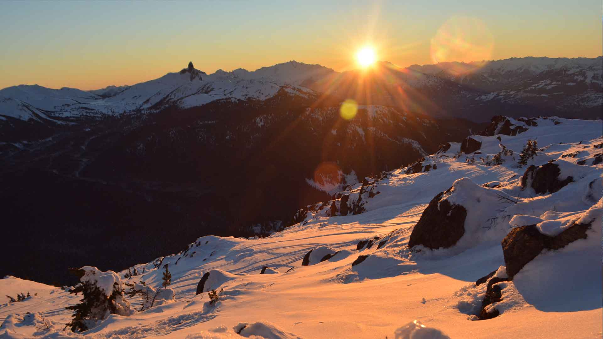 View from Whistler Mountain of the sunset dropping behind the Black Tusk