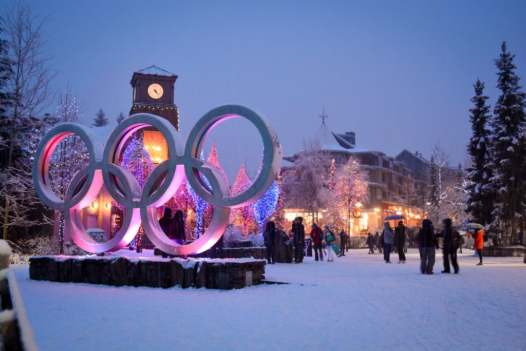 photo of Whistler village at night with the olympic rings lit up