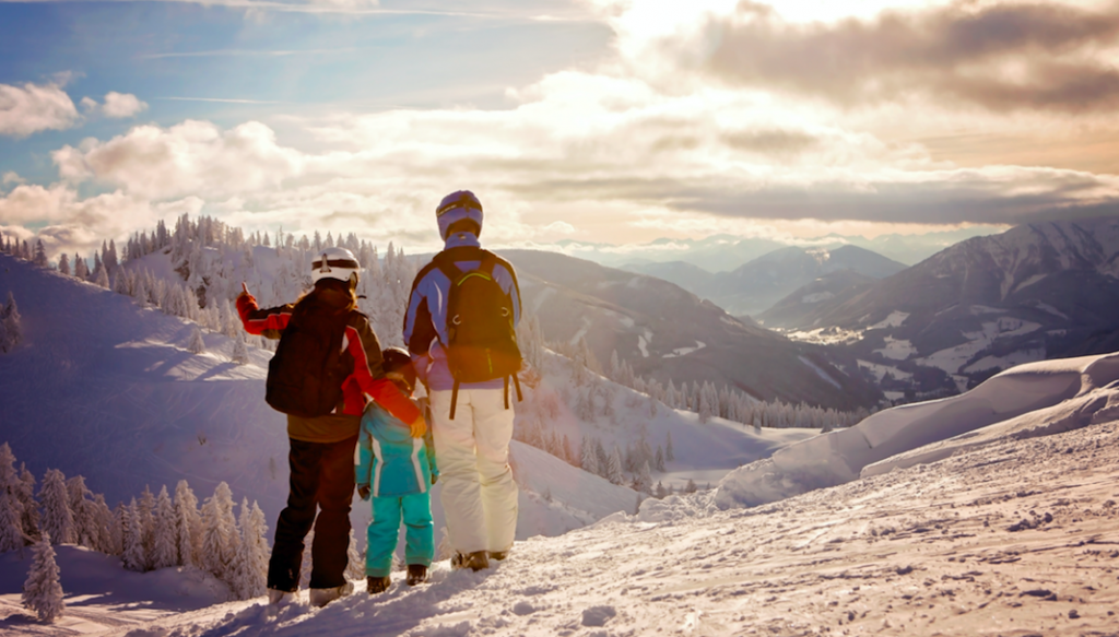 Family skiing in Whistler enjoying the view